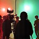 A film crew operating professional cameras on set.